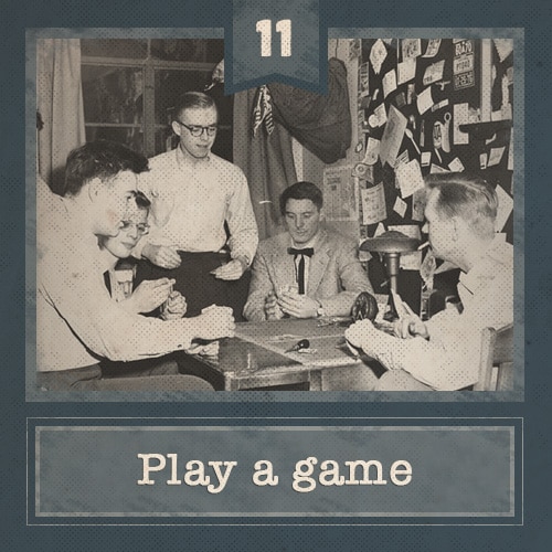Vintage men sitting around table playing poker.