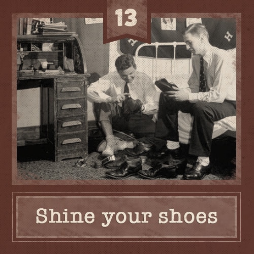 Vintage college men in dorm room shining shoes.