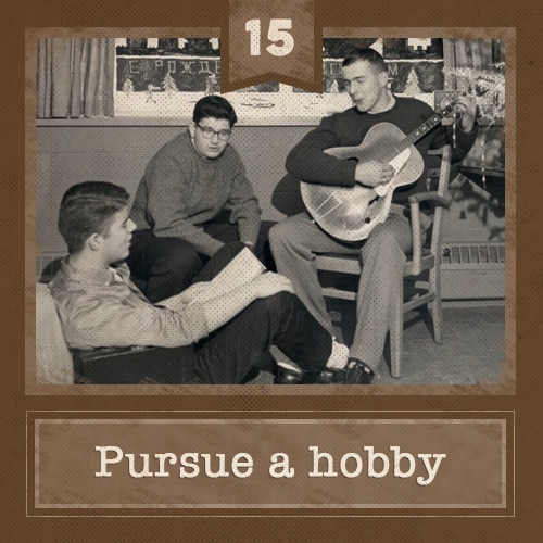 Vintage friends sitting around playing guitar.