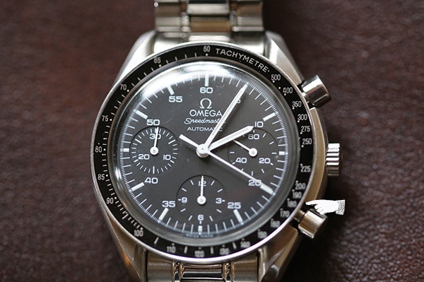 Closing of chronograph and tachymeter on a omega wristwatch.