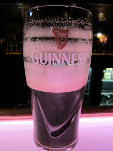 Half glass of beer and little bubble of liquid.