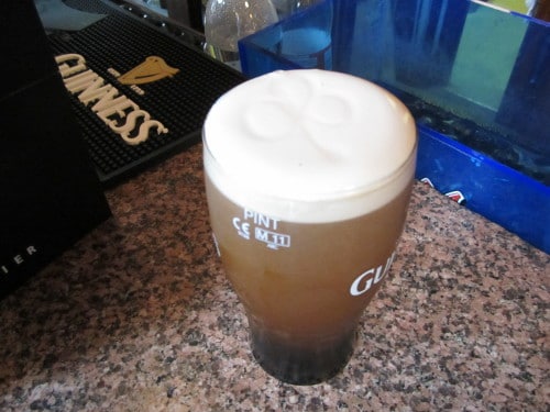 Glass of beer and the little bubble of liquid at the top of glass.