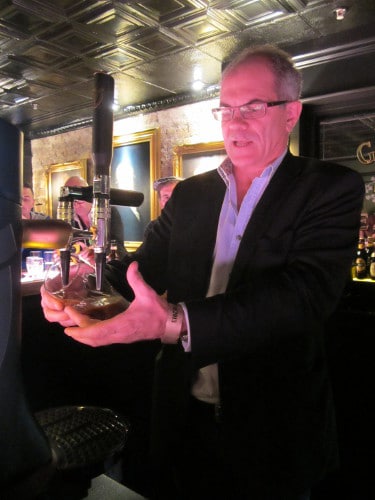 Guinness Master Brewer Fergal Murray pouring Guinness beer.