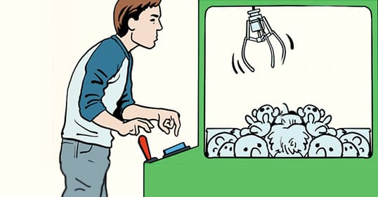 A person operates a claw machine filled with plush toys, focusing on the controls to try and beat the claw machine using clever claw machine tips.