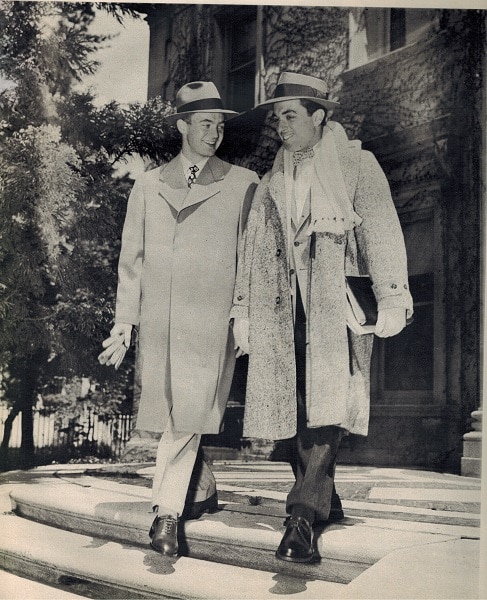 Vintage college men wearing overcoats. 