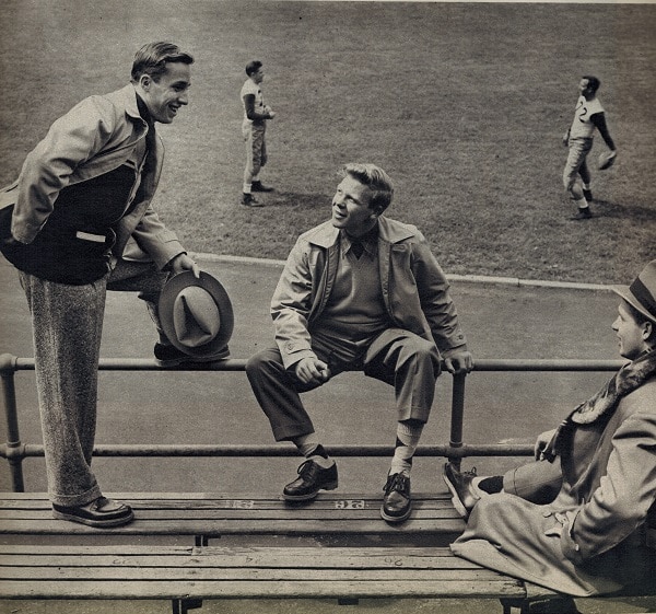 Vintage men sitting on bench and talked each other.