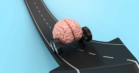 A human brain with four wheels drives on a curved, arrow-shaped road against a blue background, symbolizing the pursuit of dopamine and the need to stop chasing constant stimulation—a thought-provoking podcast visual.