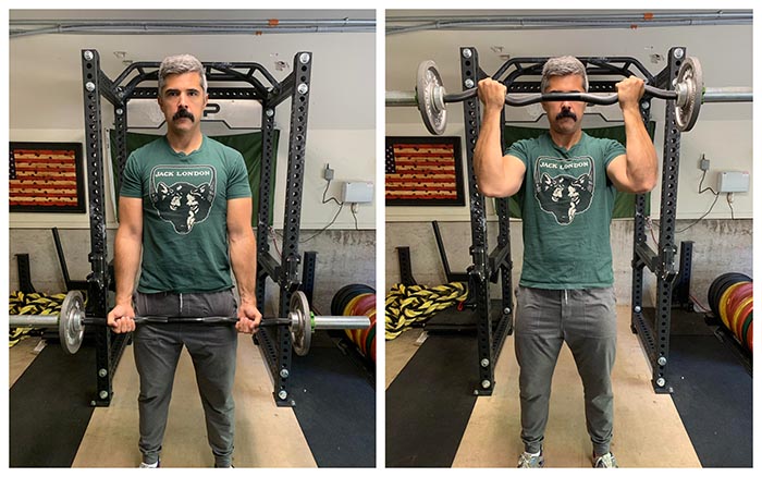 man demonstrating proper form of EZ bar bicep curl. 