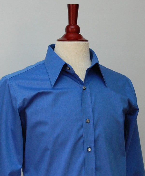 blue dress shirt Blue dress shirt hanging on dummy.