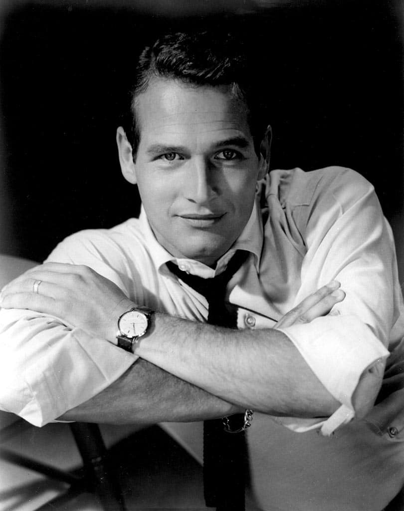 Vintage man in shirt and tie with dress watch on wrist.