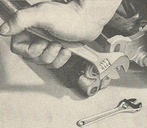 A vintage ad showcasing the mastery of toolmanship with a wrench.