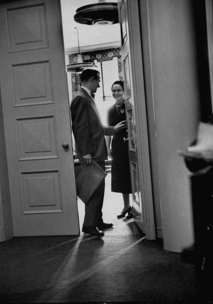 Businessman seeing off his wife for work.