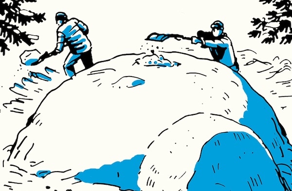 Two people shoveling snow outdoors to build a Quinzee Snow Shelter.