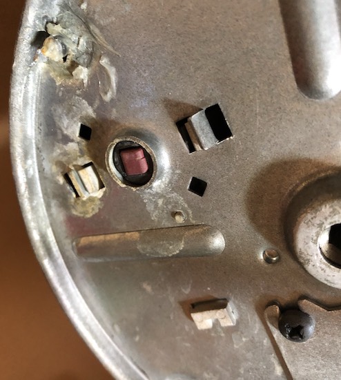 Reset button of a garbage disposal.