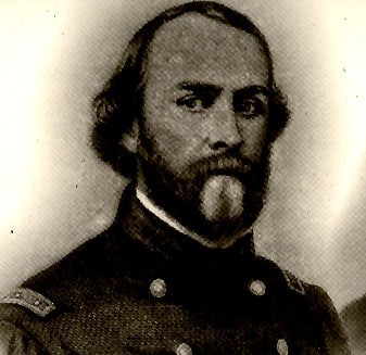 A soldier in uniform, with a beard, holding a love letter.