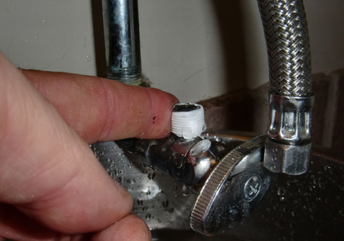 Attach the supply hose to the faucet.