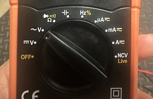 Close-up of a digital multimeter dial showing various measurement settings—ideal for a multimeter tutorial on how to use a multimeter to test voltage, current, resistance, continuity, frequency, and non-contact voltage detection.