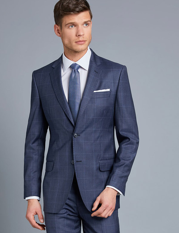 Actor wearing blue windowpane suit in Hawes and Curtis movie.