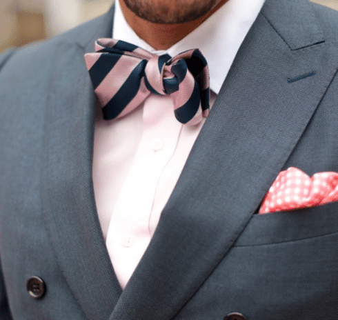 Man wearing pink striped bowtie. 